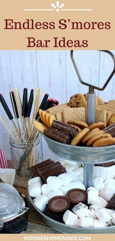 an assortment of cookies, marshmallows and s'mores on a tray