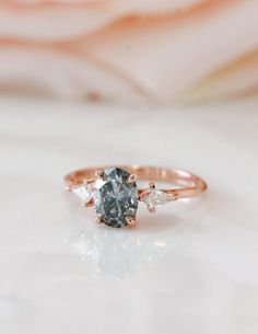 an engagement ring with three stones on it