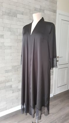 Black luxurious wedding robe, to add a perfect touch to your perfect and unique day. It can be made of high quality satin called Italian silk or natural silk. Only high quality fabrics and high finishing used for making the robe as neat as it can be. Please find the wedding robes collection here https://www.etsy.com/shop/LidiasBoutiqueDesign?ref=seller-platform-mcnav&section_id=25023222. For wedding dresses, please access https://www.etsy.com/shop/LidiasBoutiqueDesign?ref=seller-platform-mcn Elegant V-neck Robe For Evening, Elegant Satin V-neck Kimono, Elegant Open Front Night Dresses, Elegant Night Robe With V-neck, Elegant V-neck Kimono For Wedding, Elegant Wedding Robe With Lace Cuffs, Elegant V-neck Wedding Kimono, Black Satin Gown With Long Sleeves, Fitted Black Abaya For Wedding