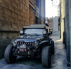 the jeep is parked on the side of the street