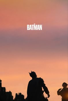 a batman movie poster with the silhouette of a man holding a bat in his hand