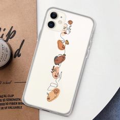 an iphone case with cartoon characters on it