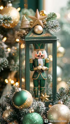 a nutcracker figurine sitting on top of a christmas tree