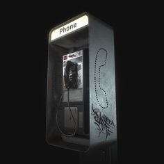 an old phone booth with graffiti on it