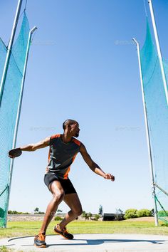 a man is throwing a frisbee in the park - stock photo - images