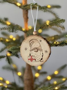 a wooden ornament hanging from a christmas tree