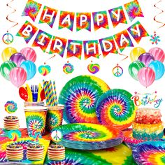 tie dye birthday party supplies including cake, cupcakes and streamers with the words happy birthday on it