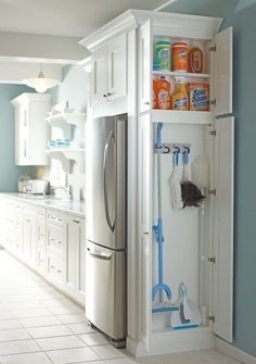 the kitchen is clean and ready to be used as a storage area for cleaning supplies