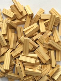 several pieces of wood sitting on top of a white countertop next to each other