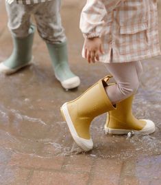 Perfect for rainy day adventures, these Toddler Rain Boots are designed in waterproof rubber. Discover thoughtful details like the extended twill finger loop for easy on-and-offs and the embossed heel. With slip resistant soles, the Rain Boot comes in three colors to Pehr with the Park Jacket, the perfect Rainwear for the coming season. Click "Find Your Size" for our Printable size chart to get the perfect fit! 100% Natural Rubber BPA Free Runs small: We recommend sizing up 2 sizes for most comf Cute Rain Boots, Toddler Rain Boots, Toddler Wearing, Honey Yellow, Rain Boot, Buy Buy Baby, Rainy Day Outfit, Mini Boden, Rain Wear