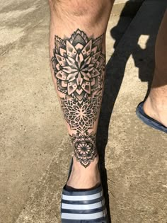 a close up of a person's foot with a tattoo on it