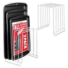 three cell phones are next to each other with magazine racks on the sides that hold them