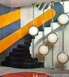 an image of a staircase with balls hanging from it's sides and on the wall