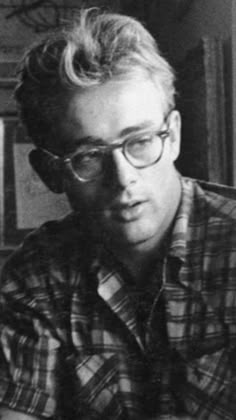 black and white photo of a man wearing glasses