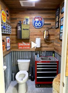 there is a small garage with a tool cabinet and a white toilet in it's stall