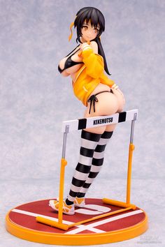 a figurine is posed on top of a hurdle with her legs spread out