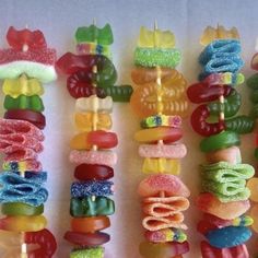 there are many colorful candy lollipops on the stick