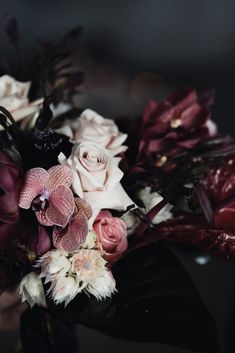 a bouquet of flowers sitting on top of a table