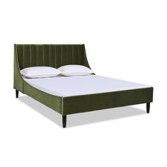 a green bed frame with white pillows on it