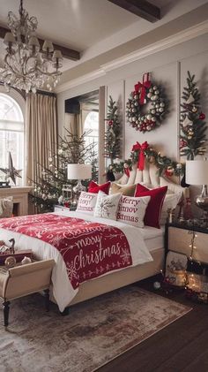 a bedroom decorated for christmas with red and white bedding, wreaths and decorations