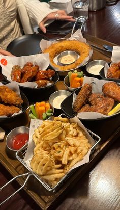 many different types of food are sitting on a tray