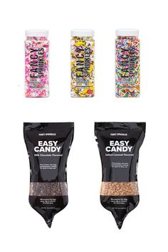 three bags of candy are shown in different colors and flavors, one is black, the other is white