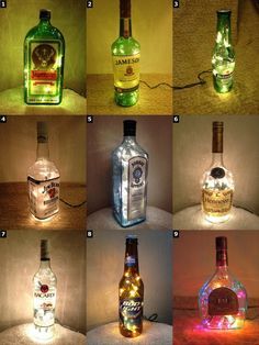 several bottles with lights in them sitting on a table next to each other, all lit up