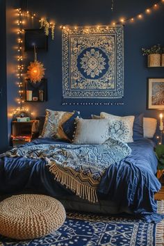 a bedroom with blue walls and lights on the ceiling