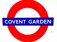 a blue and red sign that says covent garden