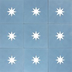 nine white stars are arranged on blue tiles