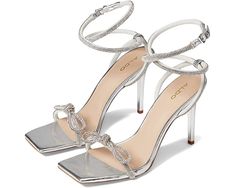 a pair of silver high heeled sandals