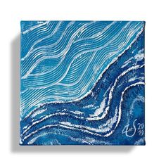 a blue and white painting with waves on it