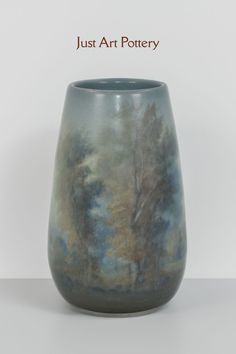 an artistic vase is shown with the words just art pottery on it's side