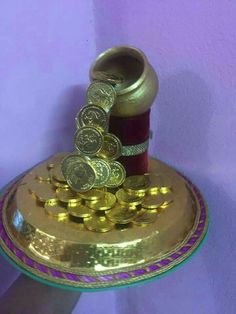 a gold plate with some coins on it