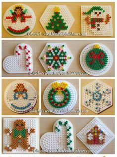 cross stitch christmas ornaments are displayed on the table