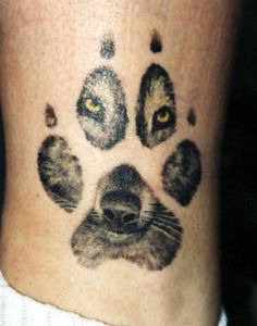 a close up of a person's foot with an animal paw print on it