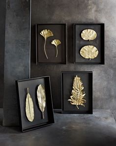 three framed pictures with gold leaves in them on the left, and one has a black frame