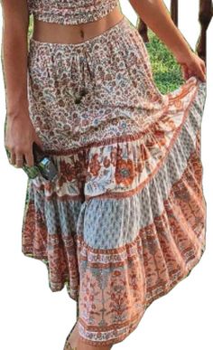 Bohemian Knee-length Skirt, Bohemian Flowy Knee-length Skirt, Orange Floral Print Long Skirt, Bohemian Orange Floral Print Skirt, Casual Orange Mini Skirt In Relaxed Fit, Orange Tiered Summer Skirt, Orange Tiered Maxi Skirt For Vacation, Casual Orange Tiered Skirt, Orange Mini Skirt For Summer