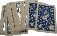 four blue and white playing cards with stars on them