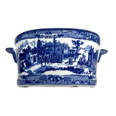 a blue and white porcelain tray with handles