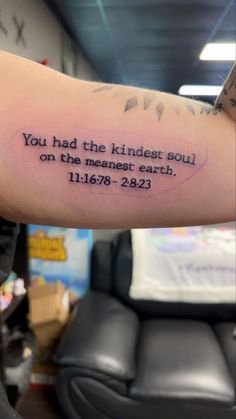 a person with a tattoo on their arm that reads, you had the kindest soul on the meannet earth