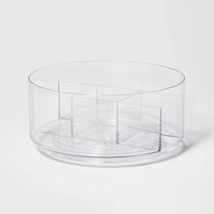 a clear plastic container with four sections on the bottom and one section in the middle