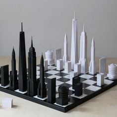 a black and white chess board with skyscrapers on it