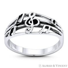 The featured ring is cast in oxidized .925 sterling silver and showcases a G-Clef centerpiece & beamed eigth notes placed along the 4-line musical staff design band. Your purchase will include a 30-Day Exchange or Money-Back Guarantee & Free US Shipping. Please email us for more details regarding this listing. Size: 7.  Gender: unisex.  Age Group: adult. Silver Music-themed Metal Jewelry, Nickel-free Metal Music-themed Jewelry, Music Note Ring, Silver Music-themed Charm Jewelry, Nickel-free Sterling Silver Music-themed Necklace, Eighth Note, Stackable Rings, Womens Bracelets, Womens Watches