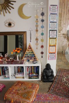 a living room filled with lots of furniture and decor on top of carpeted flooring