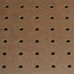 a brown surface with holes in it