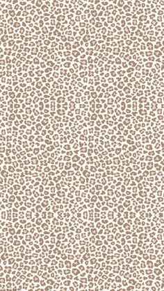 a white and brown animal print wallpaper with lots of small spots on it's surface