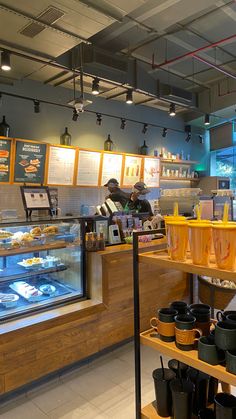 the inside of a fast food restaurant with lots of counter space and items on shelves