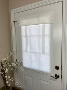 a white door with a window covering it