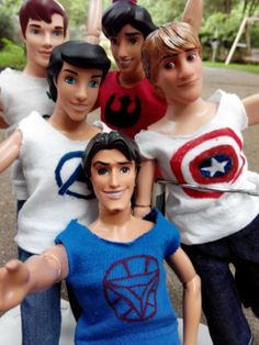 a group of action figures are posed in front of each other with their arms around one another